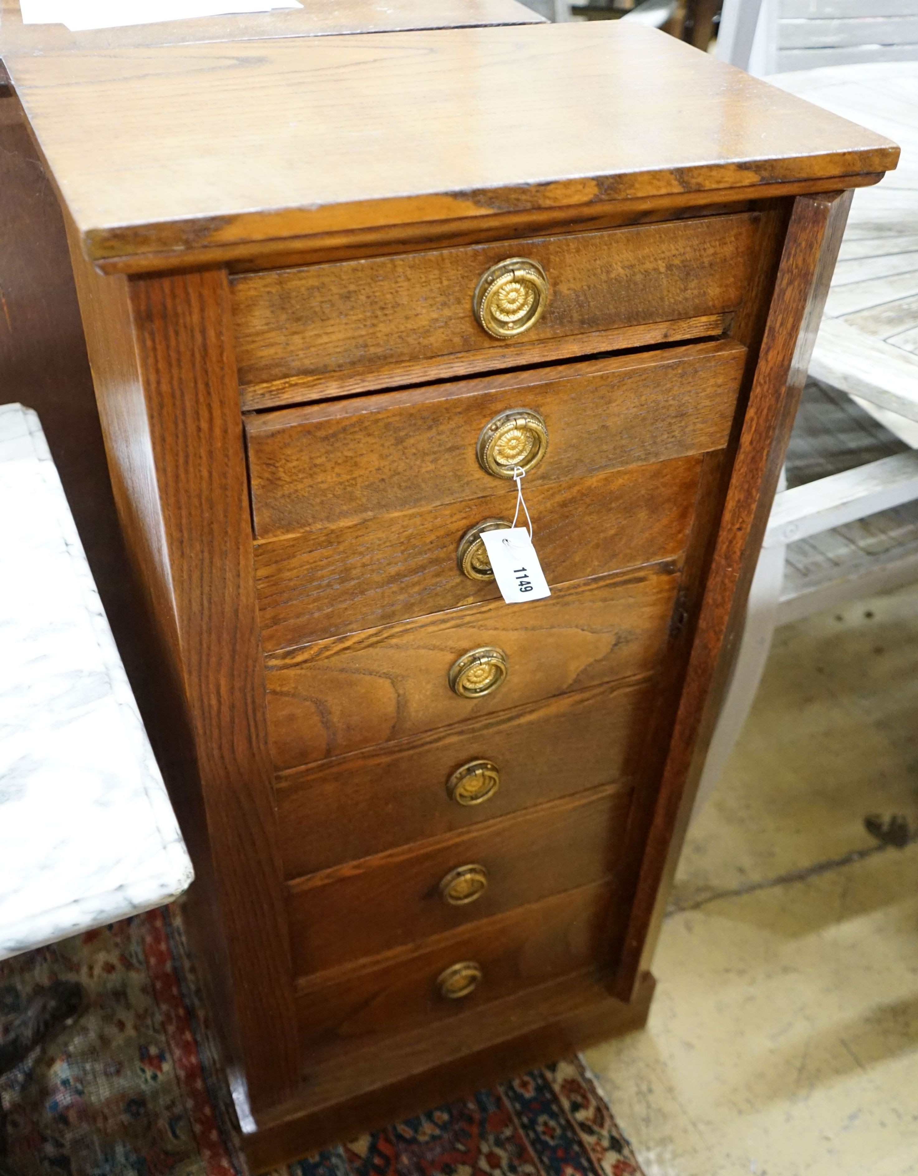 A 1920's oak Wellington chest, width 51cm depth 34cm height 105cm